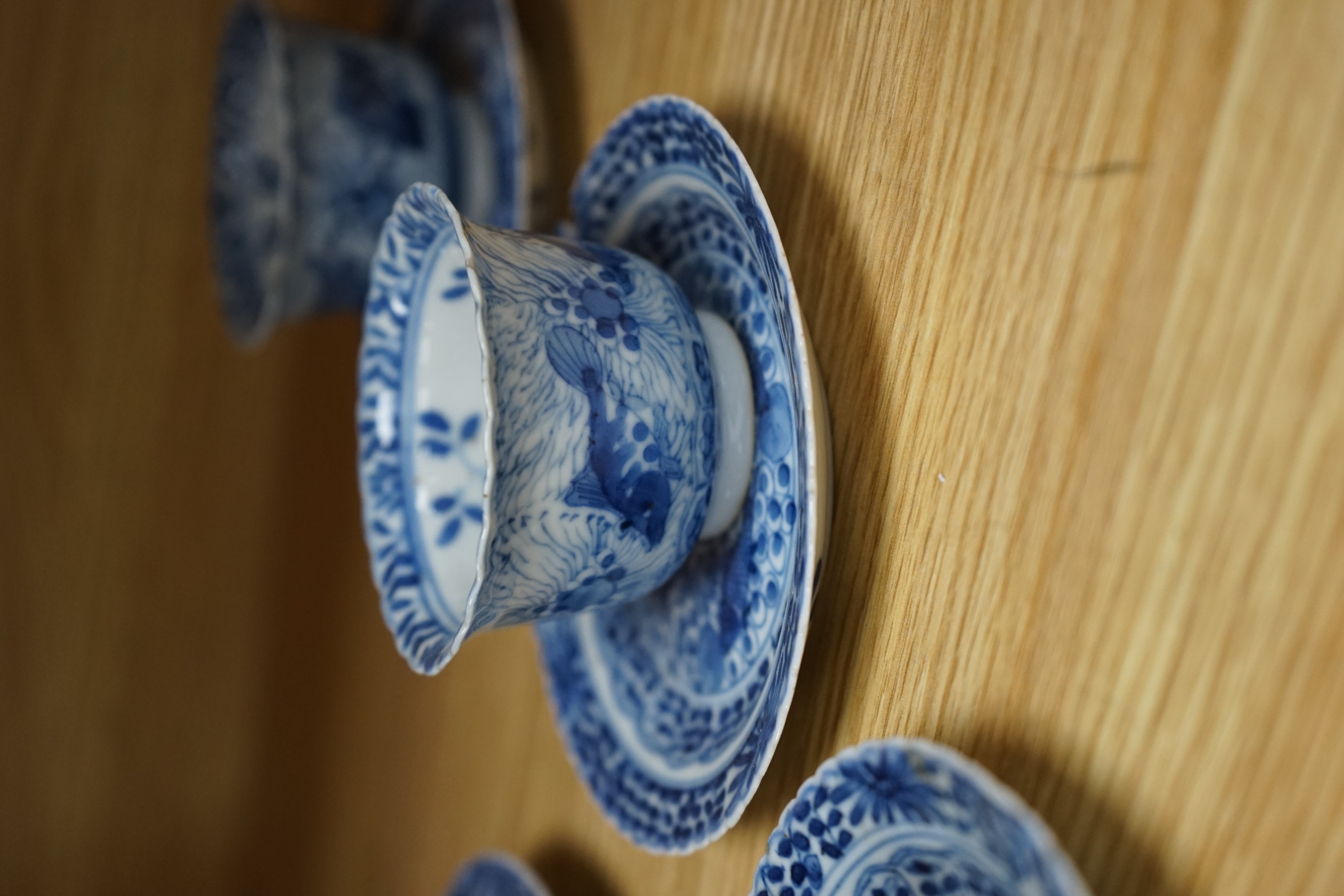 Five 19th century Chinese blue and white tea bowls and saucers, four-character marks to bases